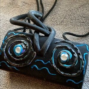 Satin evening bag cleverly decorated